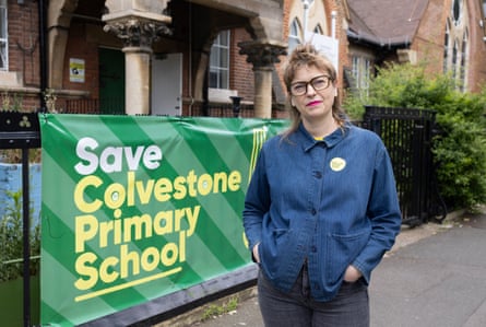 Helen James in front of sign reading ‘save Colvestone primary school’