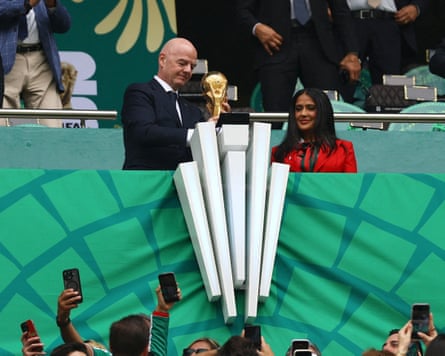 Gianni Infantino holds the golden trophy