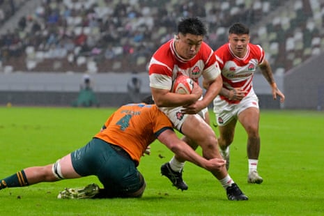 Shuhei Takeuchi pushes past Jeremy Williams to score Japan’s first try