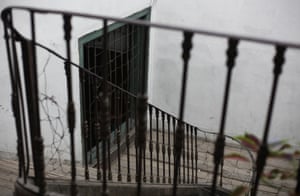 Railings repaired with barbed wire inside the building.