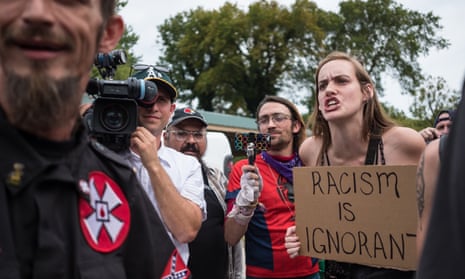 A counter-protester confronts KKK members during a rally in Madison, Indiana, 2019.