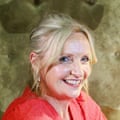 Head shot of a blonde woman in red top