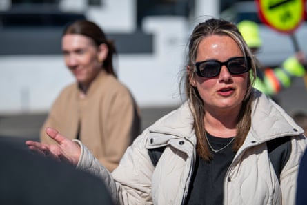 She faces the camera, talking to an off-screen Guardian reporter, gesticulating with her right hand