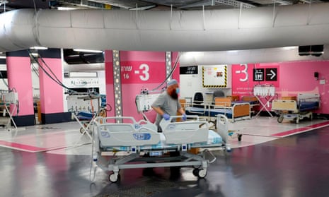 A technician prepares beds in the underground car park of Rambam Health Care Campus which was transformed into an intensive care facility for coronavirus patients.