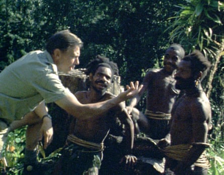 Attenborough and members of the previously uncontacted Biami tribe use gestures and sign language to communicate.