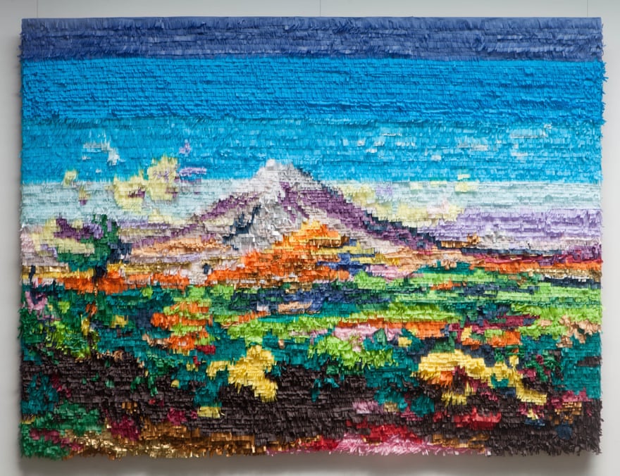 A colorful landscape is ‘painted’ in the paper fringe of piñata.