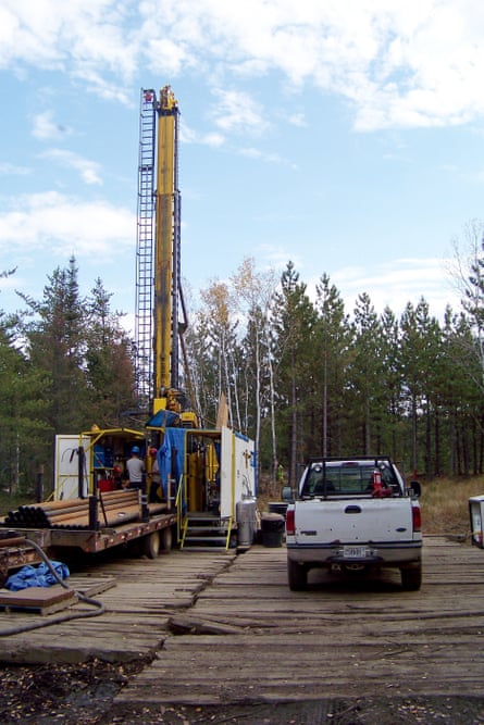a car next to a prospecting drill