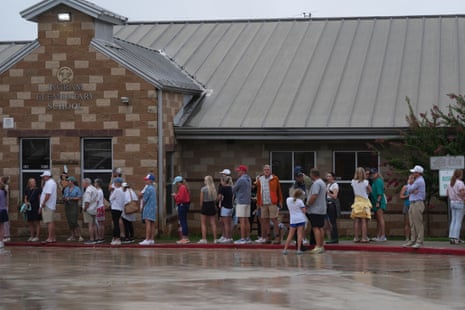Families line up at a reunification centre in Ingram, Texas.