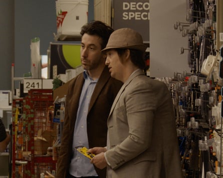 McCarrol and Johnson standing in a shop