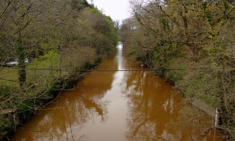 River Teign turns red due to pollution from a nearby quarry, Devon, England