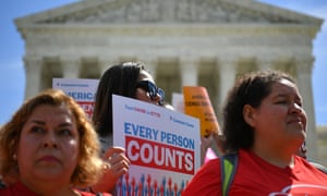 Protesters, one holding sign reading "Every person counts"