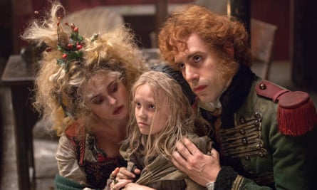 Baron Cohen with Helena Bonham Carter and Isabelle Allen in Les Misérables.