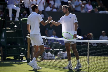 Jan-Lennard Struff (left) shakes hands with Daniil Medvedev after beating the Russian