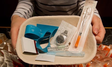A nurse holds a tray of supplies to be used by a drug addict at a safe injection clinic in Vancouver, British Columbia, Canada.