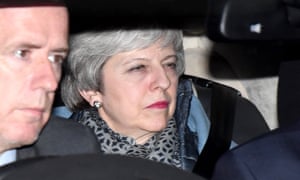 Theresa May leaves the House of Commons.
