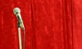 centre stage Empty microphone in front of red velvet stage curtain<br>A11BH0 centre stage Empty microphone in front of red velvet stage curtain