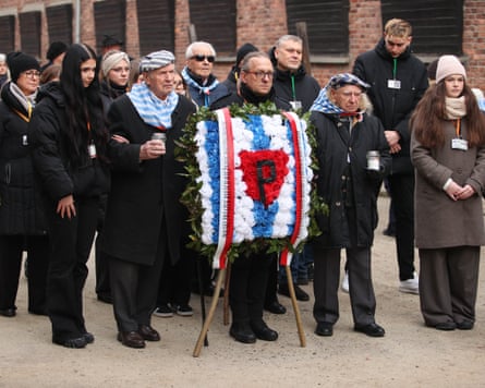 Holocaust survivors and former camp prisoners lay a wreath at the Auschwitz concentration camp