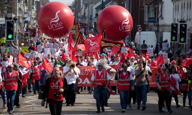 Honda workers march through Swindon with Unite union balloons and banners