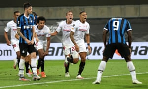 Romelu Lukaku (right) stands with his head bowed after deflecting a bicycle kick by Diego Carlos (second right) into Inter’s net.