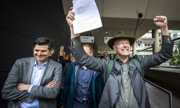 Lawyers celebrate after a Dutch court ruled against Shell.