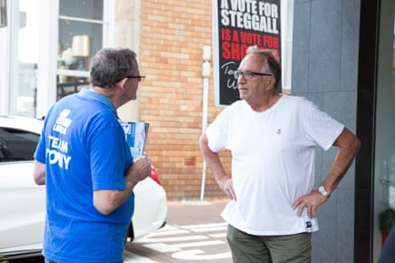 A Warringah resident disagrees with a Tony Abbott volunteer at a pre-poll booth in Mosman.