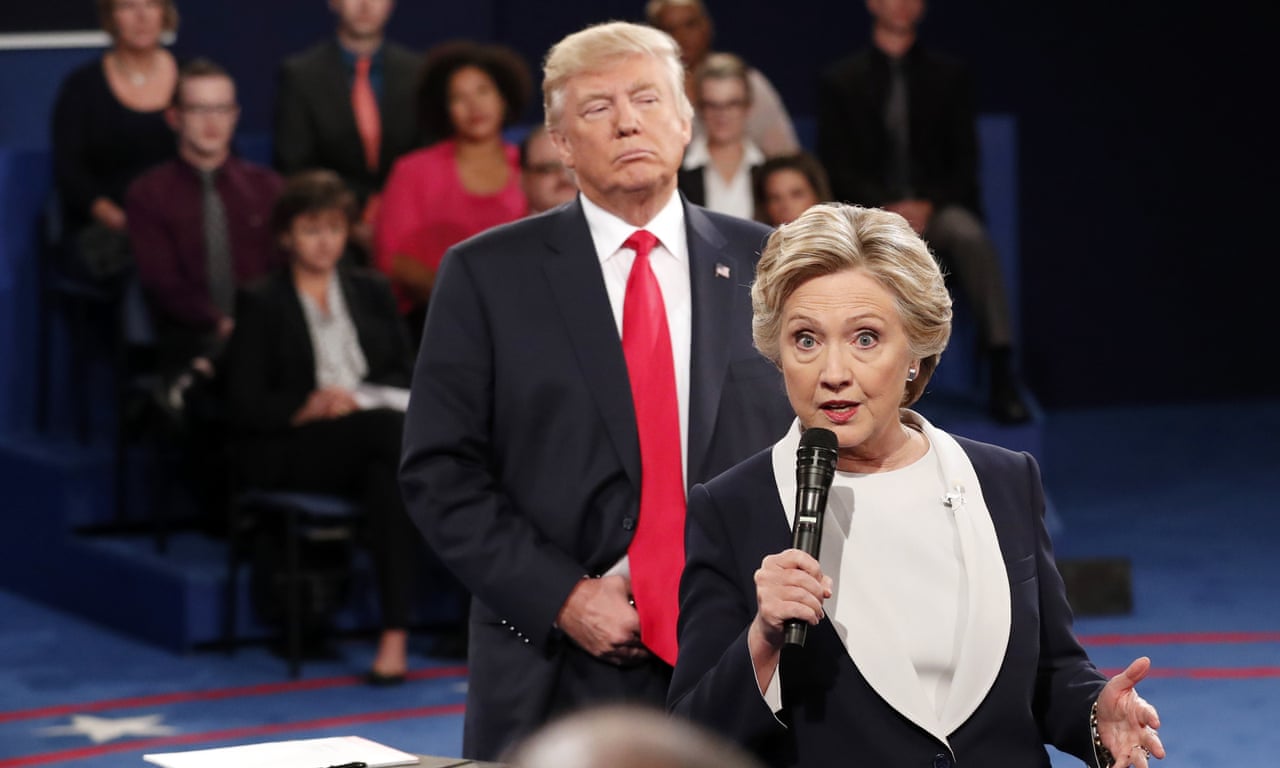 Trump 'prowls' behind Clinton during presidential debate – video | US news  | The Guardian