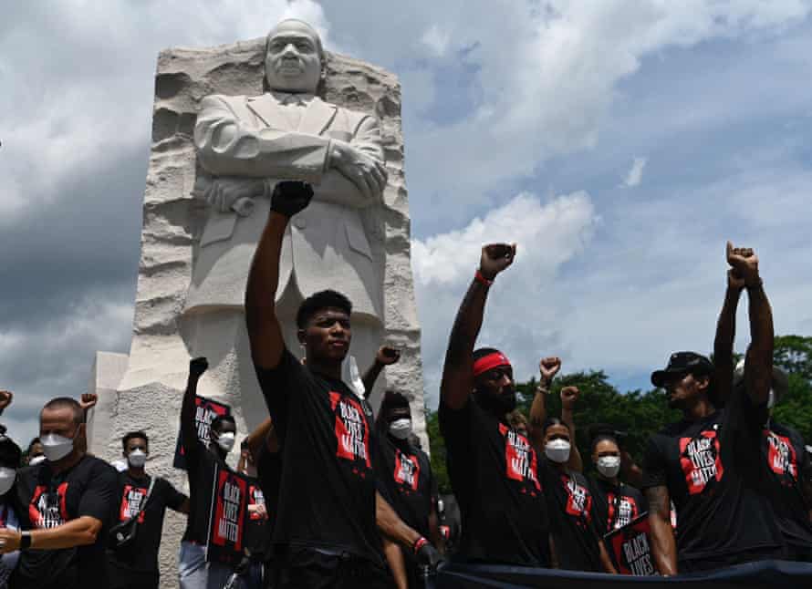 Demonstrators gather at the Martin Luther King Jr memorial in Washington DC, on 19 June.
