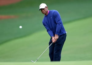 Tiger Woods plays a shot to the 14th green.