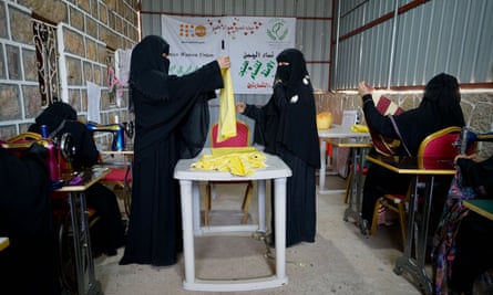 Women make clothes for victims of violence, at a support centre in Turba, north-west of Aden.
