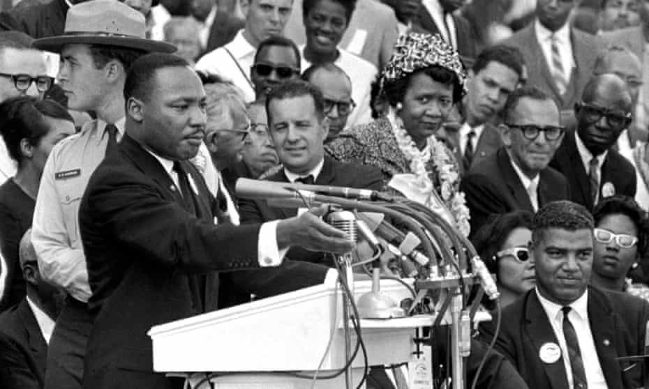 The Rev Dr Martin Luther King Jr delivers his ‘I Have a Dream speech in Washington, on 28 August 1963, as National Park Service ranger Gordon ‘Gunny’ Gundrum, left, stands beside King.