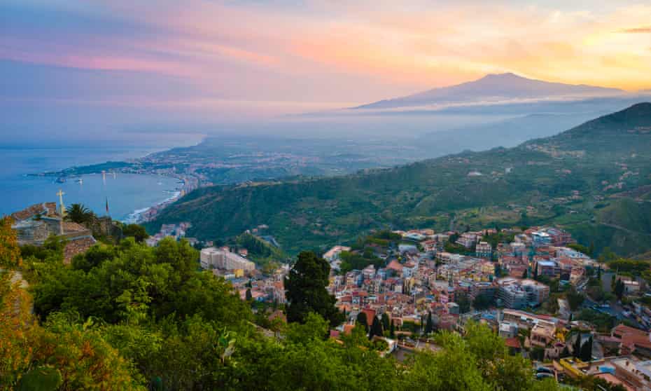 Taormina with Mount Etna at sunset.