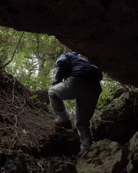 Takamatsu Gushiken searches inside caves in Itoman, Okinawa, for the remains of victims from the Battle of Okinawa