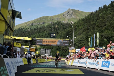 Simon Yates crosses the line to win in Le Mont Dore Puy de Sancy