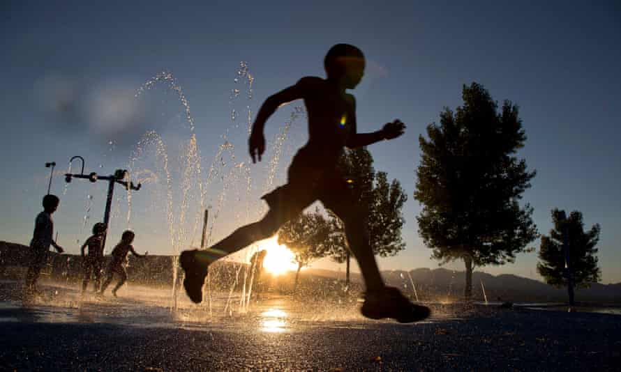 Ashawn Rabb, 5, runs through a fountain of water at the Red Ridge kids water park, in Las Vegas, in June 2013.