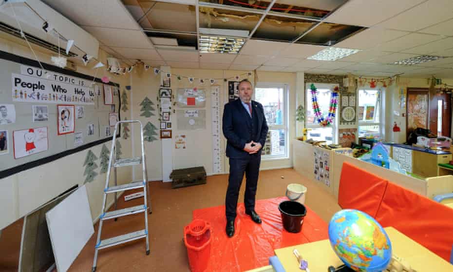 Headteacher Pepe Di’Iasio, and buckets, at Wales high school near Rotherham in south Yorkshire.