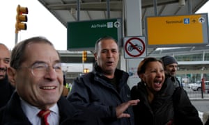 Iraqi immigrant Hameed Darweesh walks out of Terminal 4 at JFK with Congressman Jerrold Nadler (L) and Congresswoman Nydia Velazquez (R) after being released on Saturday.