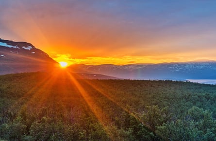 Midnight sun in summer in Abisko national park.