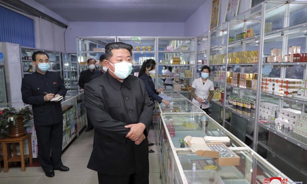 North Korean leader Kim Jong-un visits a pharmacy in Pyongyang