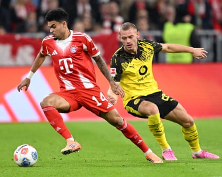 Luis Díaz eases away from Dortmund’s Julian Ryerson