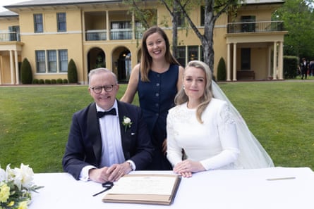 The Prime Minister Anthony Albanese and Jodie Haydon sign the marriage certificate with celebrant Bree.