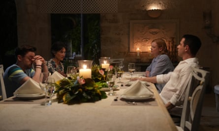 The Roy siblings (L-R: Kieran Culkin, Sarah Snook, Jeremy Strong) with their mother (Harriet Walter), sitting around a dinner table.