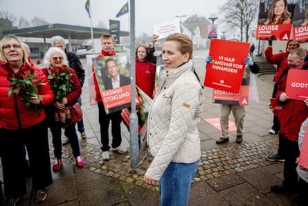 Mette Frederiksen holding a sign at an election campaign event
