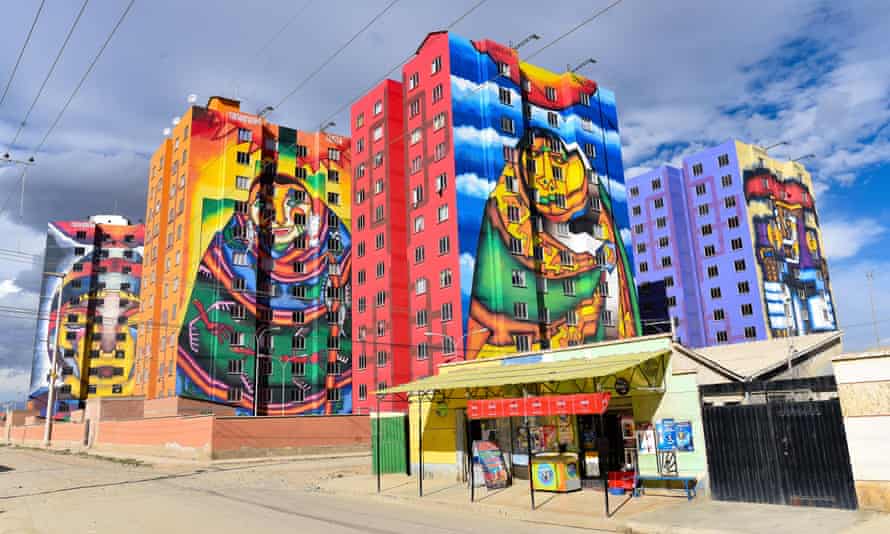 Brightly colored murals painted by Roberto Mamani (no relation) on apartment blocks in El Alto.