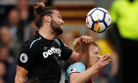 Andy Carroll’s elbow connects with Burnley’s Ben Mee, leading to a second yellow card.