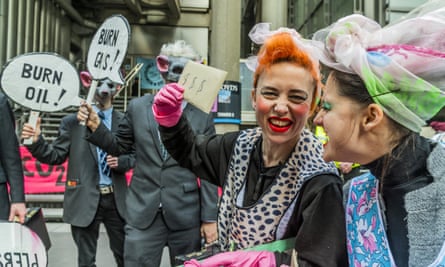 Climate crisis protesters in colourful fancy dress.