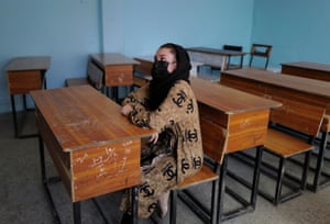 Sahar, 17, an 11th grade secondary school student, shows Reuters her former school, where she was allowed back to sit in the classroom