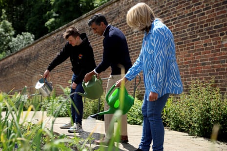Rishi Sunak waters plants as he visits a community garden project in Bishop Auckland, on Saturday.