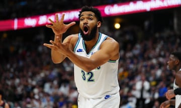 Minnesota Timberwolves center Karl-Anthony Towns reacts as his team make their way to victory over the Denver Nuggets