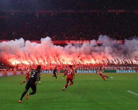 Bayern fans light flares which prove unhelpful for the hosts.