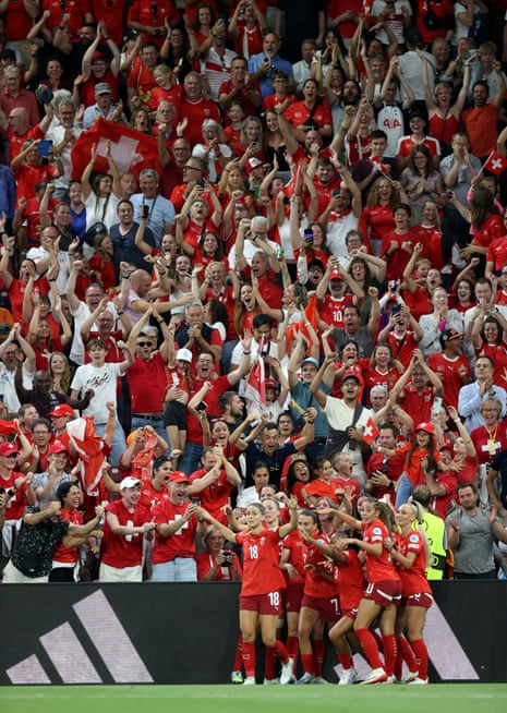 Riola Xhemaili of Switzerland celebrates scoring her team's equaliser with teammates in front of their joyous fans.